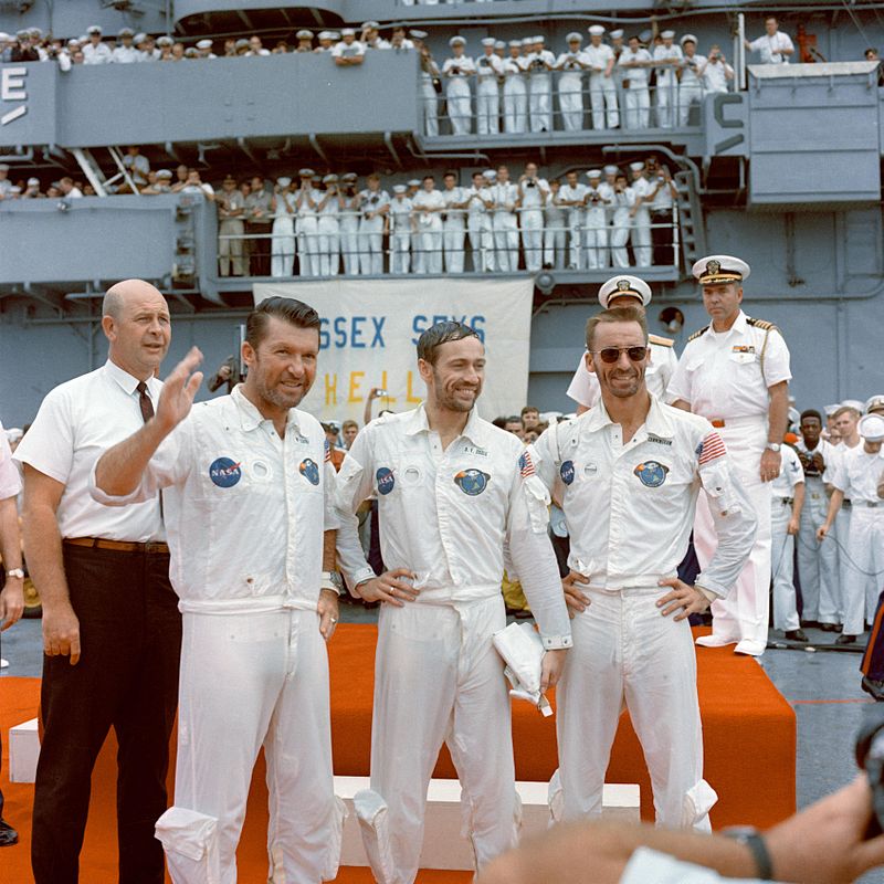 800px-The_Apollo_7_crew_is_welcomed_aboard_the_USS_Essex.jpg