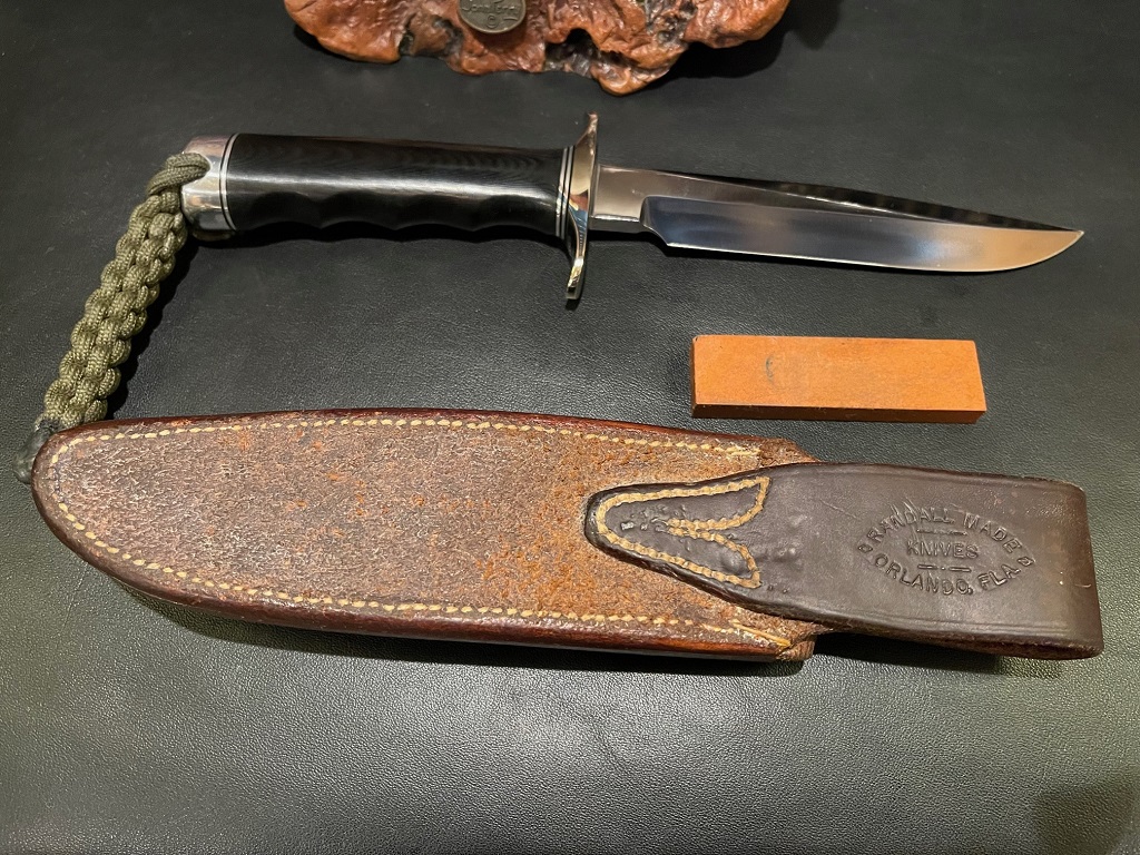 Randall # 1-6 Black Micarta FG NS Single Hilt and Butt Cap with Braided Paracord Alum & Black Spacers Tan Waxed HS Back-KT.jpg